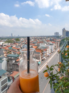 Orange juice overlooking hanoi city
